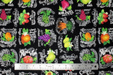 Flat swatch Wildberry Fields fabric (black fabric with neatly tossed full colour illustrative fruits and veg with white chalk look text behind "wildberry fields" etc.)