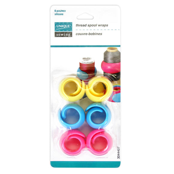 Package of 6 plastic thread spool wraps (2 yellow, 2 blue, 2 pink) on white background