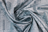 Swirled swatch Collage fabric (grey blue fabric with music related text in monochromatic shades allover in various directions. "Blues" "Love" etc)
