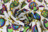 Swirled swatch Painted Shells fabric (white fabric with tossed green turtles with painted shells in blue, green, pink and yellow shades)