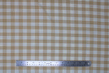 Flat swatch beige and white medium sized gingham print fabric