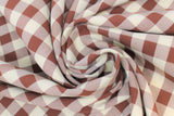 Swirled swatch burgundy and white medium sized gingham print fabric