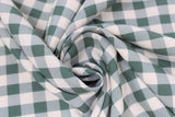 Swirled swatch emerald green and white medium sized gingham print fabric