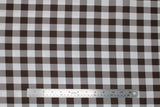 Flat swatch brown and white medium sized gingham print fabric