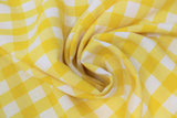 Swirled swatch yellow and white medium sized gingham print fabric