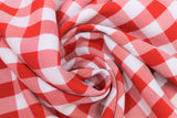 Swirled swatch bright red and white medium sized gingham print fabric