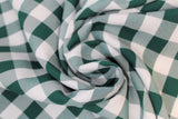 Swirled swatch green and white medium sized gingham print fabric