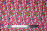 Flat swatch Pink Rainbow fabric (bubblegum pink fabric with rainbow arches with white clouds on both ends allover)