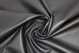 Swirled swatch black raw hide faux leather look fabric