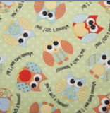Square swatch PUL Diaper Fabric (light green fabric with white polka dots and tossed cartoon large eyed owls in blue/red/yellow/orange colourway)