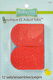 Package of 12 sets of Primary Colours Babyville Boutique EZ Adjust Tabs.  Two red tabs are visible, slightly longer than they are wide, with a rounded end on the left and squared end on the right.  The top tab is the hook side of the velcro pair, the lower tab is the loop side.  A hint of blue tab is barely visible below the red.