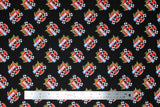 Swatch of Nascar licensed fabrics in retro racing (black)