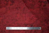 Flat swatch Algodon Marble fabric in shade burgundy (red and charcoal marbled look fabric)