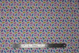 Flat swatch Multi fabric (white fabric with tiny tossed ribbons allover in: pink, yellow, blue, purple, green, lavender, etc)