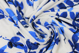 Swirled swatch off white/royal leaves fabric (off white fabric with medium large blue leafy stems allover)