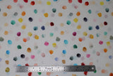 Flat swatch digital printed fabric in dots (white fabric with colourful paint blob looking dots in all different colours allover)