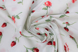 Swirled swatch playtime print in roses (white fabric with single red roses and green stems tossed)