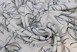 Swirled swatch white palma print (white fabric with large black outline/sketch style large floral heads and thin stems)