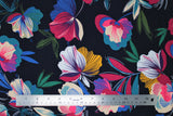 Flat swatch multi coloured flowers on navy fabric (navy fabric with large tossed multi coloured floral heads and leaves in white, pink, purple, yellow, blue, green colourway)