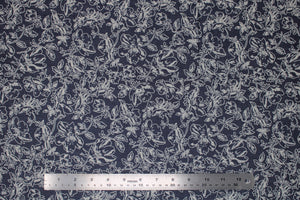 Group swatch assorted denim look fabrics with floral designs in dark and light