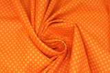 Swirled swatch Tonal Dot Orange fabric (deep orange fabric with light orange dots allover)