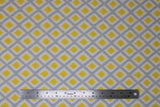 Flat swatch Diamond fabric (white fabric with criss crossed diamond lines in grey with yellow diamonds within)