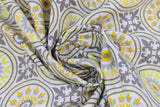Swirled swatch Mosaic White fabric (white fabric with busy mosaic look design allover in yellow and grey shades, circular mandala like badges with decorative fleur des li look squares)