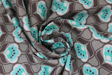 Swirled swatch Posies fabric (grey fabric with medium sized lines of white and mint coloured posies flowers with dark grey accents)