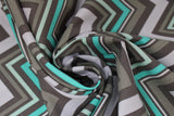 Swirled swatch Big Chevron fabric (large chevron stripe pattern allover in white, light grey, dark grey, mint, varying line widths)