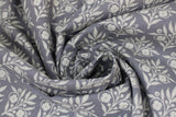 Swirled swatch Sweet Scroll Grey fabric (grey fabric with loosely packed white floral and stems in square shapes repeated allover to make diagonal lines)
