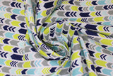 Swirled swatch arrows fabric (white fabric with thin stripes of left directional/chevron style arrows in grey, green, teal blue, navy blue)