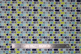 Flat swatch arrows fabric (white fabric with thin stripes of left directional/chevron style arrows in grey, green, teal blue, navy blue)