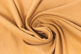 Swirled swatch organic slub cotton fabric in mustard yellow