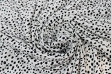 Swirled swatch Dalmatian fabric (white fabric with small black dots pattern)