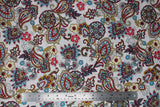 Flat swatch playtime print in white paisley (white fabric with busy white/red/blue/yellow paisley and floral print allover)