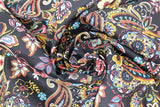 Swirled swatch playtime print in black paisley (black fabric with busy white/red/blue/yellow paisley and floral print allover)