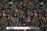 Flat swatch playtime print in black paisley (black fabric with busy white/red/blue/yellow paisley and floral print allover)