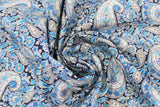 Swirled swatch blue paisley fabric (black fabric with large collaged blue deconstructed paisley pattern allover)