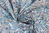 Swirled swatch teal paisley fabric (white fabric with large blue/teal deconstructed paisley pattern shapes allover with grey accents)