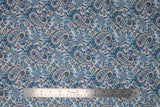 Flat swatch teal paisley fabric (white fabric with large blue/teal deconstructed paisley pattern shapes allover with grey accents)