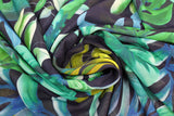Swirled swatch Digital Hi Twist Chiffon fabric (dark fabric with collaged illustrative style jungle leaves in various styles and shades of green)