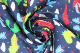 Swirled swatch dinosaurs fabric (dark navy fabric with simple cartoon tossed dinosaurs in red, blue, green, grey shades, tossed clouds, polka dots, trees and leaves)