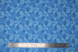 Flat swatch Gabrielle fabric (medium blue fabric with blue swirly floral/greenery allover)