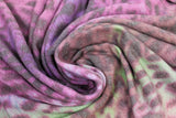 Swirled swatch Lili Fleece Print fabric (multicoloured fabric: pink, purple, green with black leopard look animal spots/print)