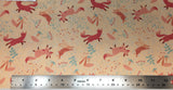 Flat swatch woodland fox and bunny printed fabric in yellow (faded peach/yellow fabric with tossed pink/orange cartoon foxes and bunnies, pink mushrooms, white/pink/green floral and greenery designs)
