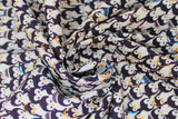 Swirled swatch penguins fabric (cartoon style collaged penguins allover in various winter hats or headbands or nothing on head)