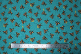 Flat swatch Coco's Safari - monkey fabric (aqua blue fabric with tossed cartoon style monkeys in brown shades with yellow hats)