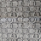 Square swatch upholstery fabric with tiled doodle circles and square print pattern allover (off white/light grey fabric with white and black pattern)