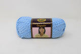 Ball of boucle yarn in blueberry (pale blue)