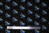 Flat swatch Roller Skates fabric (black fbaric with tossed blue roller skates and sparkles allover)